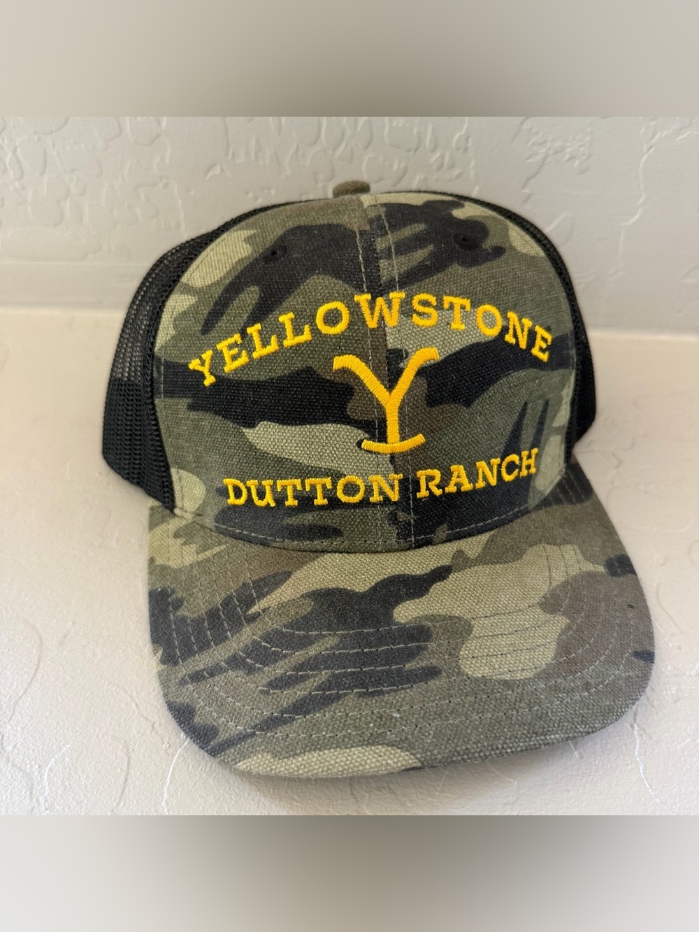 Yellowstone Dutton Ranch Camo Trucker Hat - Olive Green with Yellow Embroidery